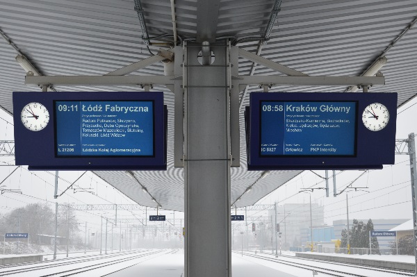 doubleside platform displays with next train information in winter time