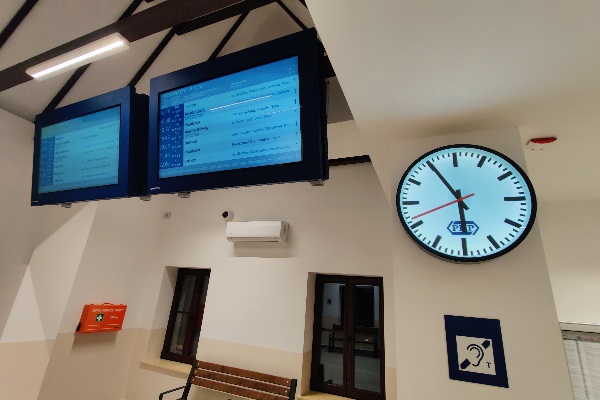 small and medium railway station with passenger information displays